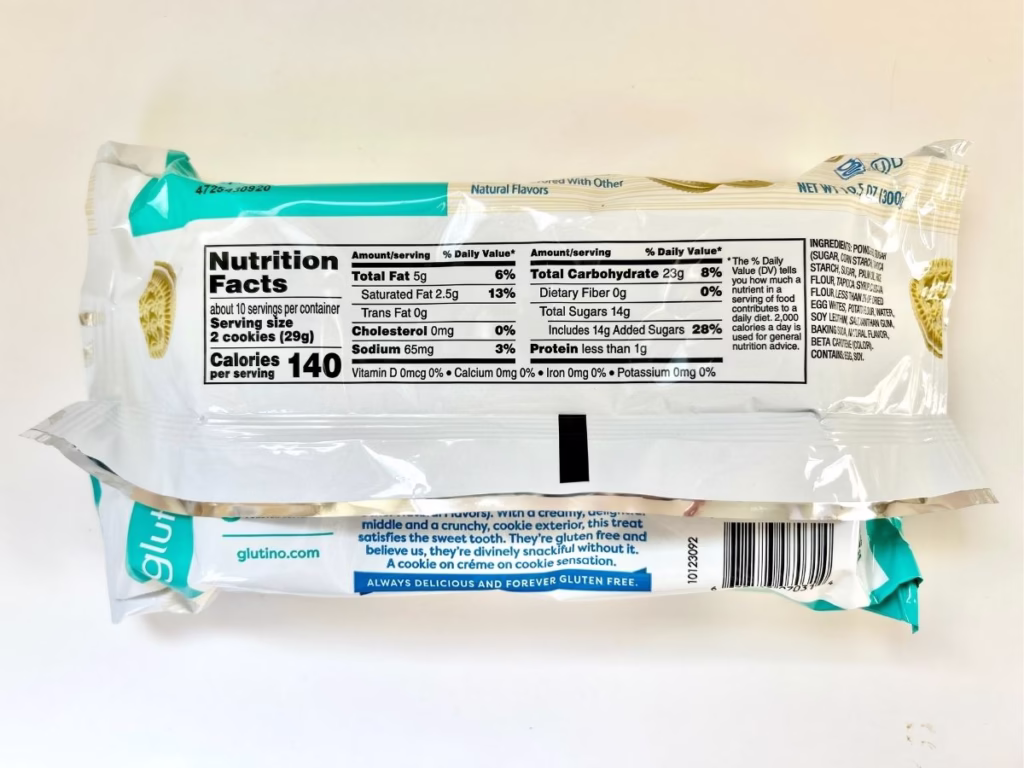A light blue and white package of Glutino cookies is shown from the back, displaying nutritional information, ingredients, and brand messaging.