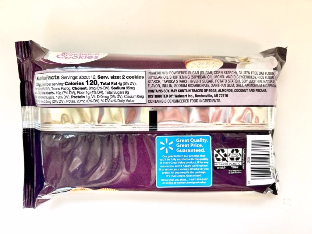 A dark purple and white package of "Great Value" sandwich cookies is shown from the back, displaying nutritional information, ingredients, and branding.